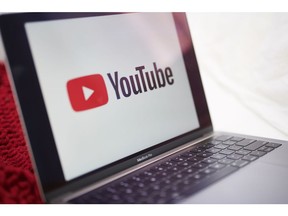 The logo for YouTube Inc. is displayed on a laptop computer.