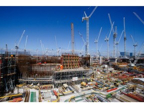 Cranes surround Reactor Unit Two on the construction project for Hinkley Point C nuclear power station, operated by Electricite de France SA (EDF), near Bridgwater, U.K, on Tuesday, July 28, 2020. EDF owns about two-thirds of the Hinkley Point program while China General Nuclear Power Group Corp. holds the rest.