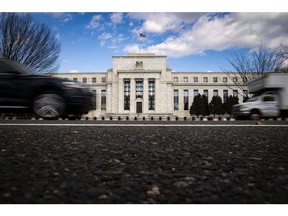The Marriner S. Eccles Federal Reserve building in Washington, D.C., U.S., on Friday, Jan. 22, 2021. Federal Reserve officials meeting next week are likely to put off any changes in their bond-buying program until 2022, when a tapering of purchases may begin, according to economists surveyed by Bloomberg News. Photographer: Al Drago/Bloomberg