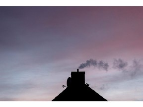 Vapor from the chimney of a home in Germany. Photographer: Krisztian Bocsi/Bloomberg