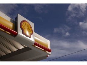 A sign on a forecourt canopy at a petrol station operated by Shell Plc in Surrey, UK, on Monday, Oct. 30, 2023. Shell are due to report their third-quarter results on Nov. 2. Photographer: Jason Alden/Bloomberg