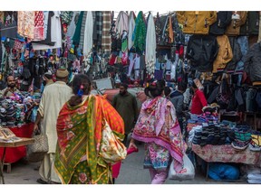 Customers at a market in Karachi, Pakistan, on Tuesday, Nov. 28, 2023. Pakistan is scheduled to release consumer price index (CPI) figures on Dec 1.