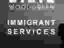 A sign advertising services for immigrants in Toronto.