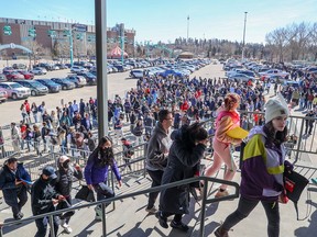 Thousands of people line up for the 2023 Youth Hiring Fair at Stampede Park on April 6, 2023.