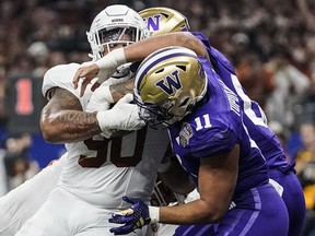 Texas defensive lineman Byron Murphy II (90) runs into the end zone for a touchdown against Washington during the first half of the Sugar Bowl CFP NCAA semifinal college football game on Jan. 1 in New Orleans.