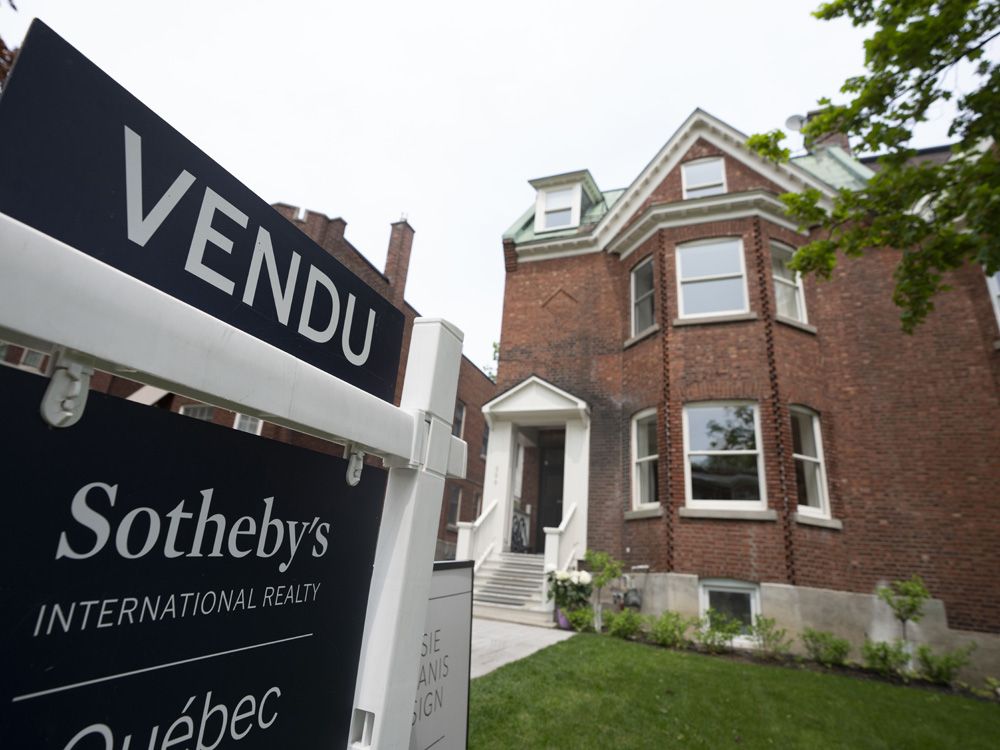 Real estate signage showing a home that has sold in Montreal.