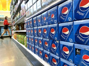 Pepsi products are displayed for sale in a store.