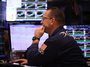 Traders work on the floor of the New York Stock Exchange during afternoon trading in New York City.