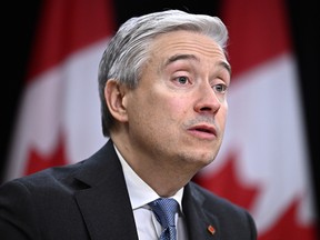 Industry Minister Francois-Philippe Champagne speaking during a news conference at the National Press Theatre in Ottawa.