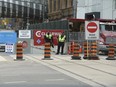 Looking eastbound and westbound along the construction corridor that will shut down Queen St. East and West for the next four and a half years to accommodate the building of a section of the Ontario Line subway project in Toronto.