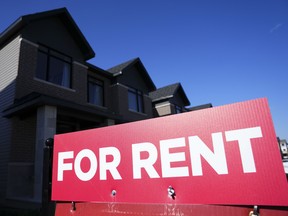 A 'for rent' sign is displayed on a house in Ottawa.