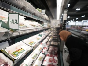 A women shops in the halal food section inside a Metro grocery store in Milton, Ont., on Friday, January 12, 2024.