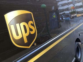 FILE - A United Parcel Service truck is parked on a street, in New York, Thursday, May 11, 2023. Shares of UPS are falling before the market open on Tuesday, Jan. 30, 2024, as the package delivery company gave a weaker-than-expected full-year revenue forecast.