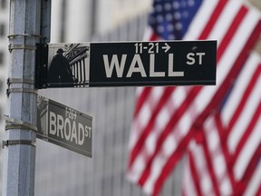 A street sign is seen in front of the New York Stock Exchange