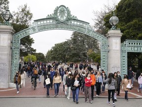 File - Students make their way through the Sather Gate near Sproul Plaza on the University of California, Berkeley, campus March 29, 2022, in Berkeley, Calif. The Free Application for Federal Student Aid is available for the 2024-2025 school year, three months later than usual.