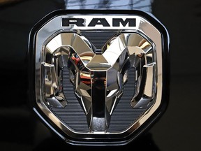 FILE - This Feb. 13, 2020 photo shows the Ram truck logo at the 2020 Pittsburgh International Auto Show in Pittsburgh. U.S. auto safety regulators will not seek a recall after a seven-year investigation into complaints that more than 1 million Dodge and Ram vehicles can roll away after being shifted into park.