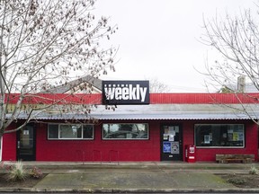 FILE - The red office building of the Eugene Weekly sits in Eugene, Ore., on Friday, Dec. 29, 2023. The Oregon weekly newspaper that had to lay off its entire staff after its funds were embezzled by a former employee will relaunch its print edition in February 2024, its editor said, a move made possible in large part by fundraising campaigns and community contributions.