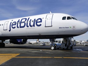 FILE - A JetBlue airplane is shown at John F. Kennedy International Airport in New York, March 16, 2017. JetBlue said Monday, Jan. 8, 2024, that CEO Robin Hayes will step down next month and be replaced by the airline's president, Joanna Geraghty, who will be the first woman to lead a major U.S. carrier.