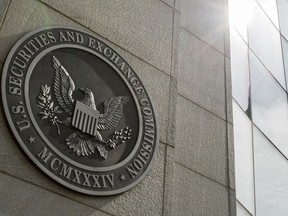 FILE - The seal of the U.S. Securities and Exchange Commission at SEC headquarters, June 19, 2015, in Washington. The Securities and Exchange Commission said Tuesday, Jan. 9, 2024, that a post on X, formerly known as Twitter, announcing that the securities regulator had approved the trading of exchange-traded funds holding bitcoin was fake, and that the agency's account had been "compromised."