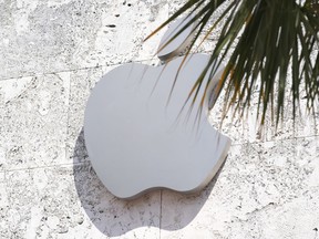 FILE - The Apple logo is displayed over their store, Sept. 19, 2023, in Miami Beach, Fla. On Wednesday, Jan. 17, 2024, a federal appeals court decided to revive a U.S. sales ban on Apple's premium watches while it referees a patent dispute revolving around a sensor, raising the specter that the company will pull the devices from stores for the second time in less than a month.