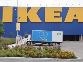 An electric delivery vehicle sits charging at an Ikea furniture store in Ottawa on Thursday, August 17, 2023. Experts say businesses in Canada are slowly entering a fleet transition journey to meet zero-emissions goals but it will not be an easy road.
