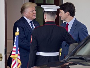 Donald Trump shakes hands with Justin Trudeau at the West Wing of the White House in June 2019.