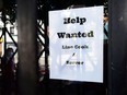 A help wanted sign posted at a restaurant. Accommodation and food services is one sector employing many temporary foreign workers.
