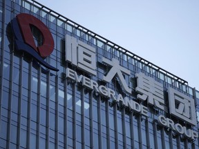 FILE - The Evergrande Group headquarters logo is seen in Shenzhen in southern China's Guangdong province on Sept. 24, 2021. A top executive of China Evergrande's electric vehicle company has been detained by police in the latest sign of trouble for the world's most heavily indebted property developer.