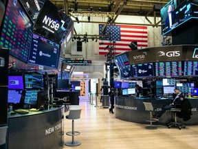 Traders work on the floor of the New York Stock Exchange