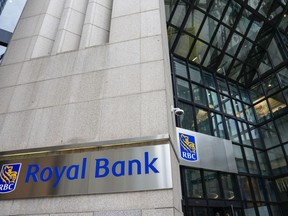 Royal Bank of Canada signage is pictured in the financial district in Toronto, Friday, Sept. 8, 2023. New York City pension funds are pushing Royal Bank of Canada to disclose details on its clean energy funding.
