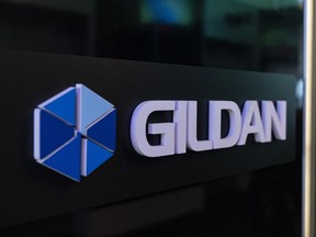 The Gildan logo is seen outside their offices in Montreal, Monday, Dec. 11, 2023. U.S. investment firm Browning West has requested a special meeting of Gildan Activewear Inc. shareholders to replace a majority of the company's directors and reinstate Glenn Chamandy as chief executive.THE CANADIAN PRESS/Christinne Muschi