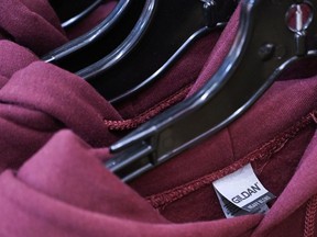 Gildan sweaters on hangers