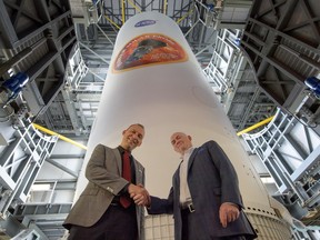This handout picture released by NASA on Aug. 11, 2018, shows NASA associate administrator for the Science Mission Directorate Thomas Zurbuchen, left, and Tory Bruno, chief executive of United Launch Alliance.