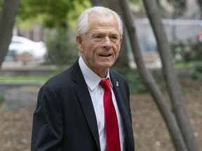 FILE - Former Trump White House trade adviser Peter Navarro arrives at the E. Barrett Prettyman U.S. Federal Courthouse, in Washington, Aug. 28, 2023. A federal judge on Tuesday, Jan. 16, 2024, rejected a bid for a new trial for Navarro, who was convicted of contempt of Congress for refusing to cooperate with a congressional investigation into the Jan. 6, 2021, attack on the U.S. Capitol.