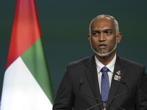 FILE - Maldives President Mohamed Muizzu speaks during a plenary session at the COP28 U.N. Climate Summit, Friday, Dec. 1, 2023, in Dubai, United Arab Emirates. The Maldives government has confirmed giving clearance to a Chinese ship to dock in its port, a move which could further irk India with whom the tiny archipelago nation is involved in a diplomatic spat.