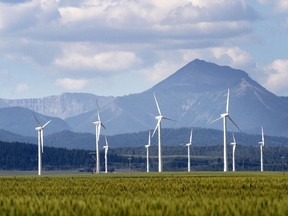 Wind turbines are seen near Pincher Creek. Alberta will institute new rules for renewable energy projects, limiting their construction on farmland and adding buffers to protect landscape views.