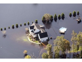 A North Carolina home surrounded by floodwater in September 2018. Record floods covered much of the eastern part of the state in the wake of Hurricane Florence. Photographer: Alex Wroblewski/Bloomberg