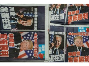 Copies of the Apple Daily newspaper, published by Next Digital Ltd., at the company's printing facility in Hong Kong, China, early on Thursday, Nov. 5, 2020. Democrat Joe Biden took narrow leads over Donald Trump in two critical Midwestern states with the presidential race hanging in the balance for a second day.