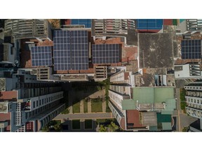 Solar panels on the roof of an apartment block in Bengaluru, India, on Monday, Feb. 21, 2022. Solar power, which has become the cheapest source of new power, is growing fast. India aims to install 175 gigawatts of renewable energy, three times the amount currently deployed in the U.K., in 2022.