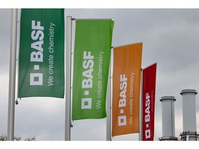 Flags at an entrance to the BASF SE chemical plant in Ludwigshafen, Germany, on Tuesday, April 25, 2023. BASF SE reported mixed preliminary first-quarter results, with higher-than-expected operating profit and revenue that missed analyst expectations after rising energy costs reduced the company's output. Photographer: Alex Kraus/Bloomberg