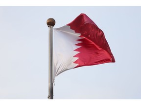 A Qatari national flag outside the venue for the Qatar Economic Forum (QEF) in Doha, Qatar, on Wednesday, May 24, 2023. The third Qatar Economic Forum will shine a light on the rising south-to-south economy and the new growth opportunities it presents to the global business community. Photographer: Christopher Pike/Bloomberg