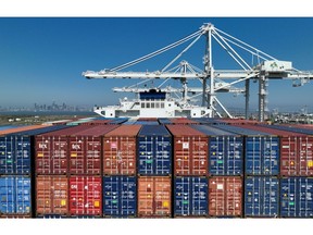 OAKLAND, CALIFORNIA - AUGUST 07: In an aerial view,  shipping containers sit stacked on a container ship docked at the Port of Oakland on August 07, 2023 in Oakland, California. According to the report by the Census Bureau, U.S. imports from China fell 24 percent during the first five months of 2023 compared to the same period one year ago.