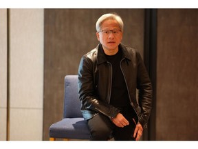 Jensen Huang, co-founder and chief executive officer of Nvidia Corp., speaks at a roundtable in Singapore, on Wednesday, Dec. 6, 2023. Huawei Technologies Co. is among a field of "very formidable" competitors to Nvidia in the race to produce the best AI chips, according to Huang.