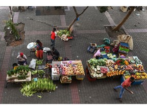 Informal street market stalls display fresh produce for sale in the Soweto district of Johannesburg, South Africa, on Thursday, Feb. 1, 2024. South African retailers are offering fewer discounts and passing on rising prices to shoppers even after consumer confidence on the continent's third-largest economy remained subdued for 18 straight quarters.
