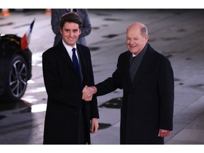 Olaf Scholz, Germany's chancellor, right, greets Gabriel Attal, France's prime minister, at the Chancellery in Berlin.