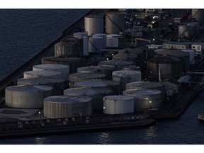 Oil storage tanks at Osaka Bay in Osaka, Japan, on Monday, Feb. 12, 2024. Japan is scheduled to release its fourth-quarter gross domestic product (GDP) figures on Feb. 15. Photographer: Buddhika Weerasinghe/Bloomberg