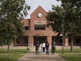 Students walk on campus at Cape Breton University in Sydney, Nova Scotia.