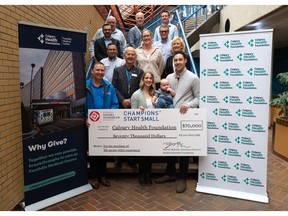 `Calgary Health Foundation CEO, Murray Sigler, receives generous donation from the Sandra Schmirler Foundation at a cheque presentation at the Scotties Tournament of Hearts