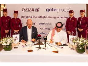Chief Executive Officer of gategroup Mr. Christoph Schmitz and Qatar Airways Group Chief Executive, Engr. Badr Mohammed Al-Meer signing the agreement.