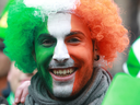 A reveller with his face painted the colours of the Irish flag attends St Patrick's Day festivities in Dublin. In the last decade, Ireland’s growth has out-paced Canada’s to an astonishing extent.